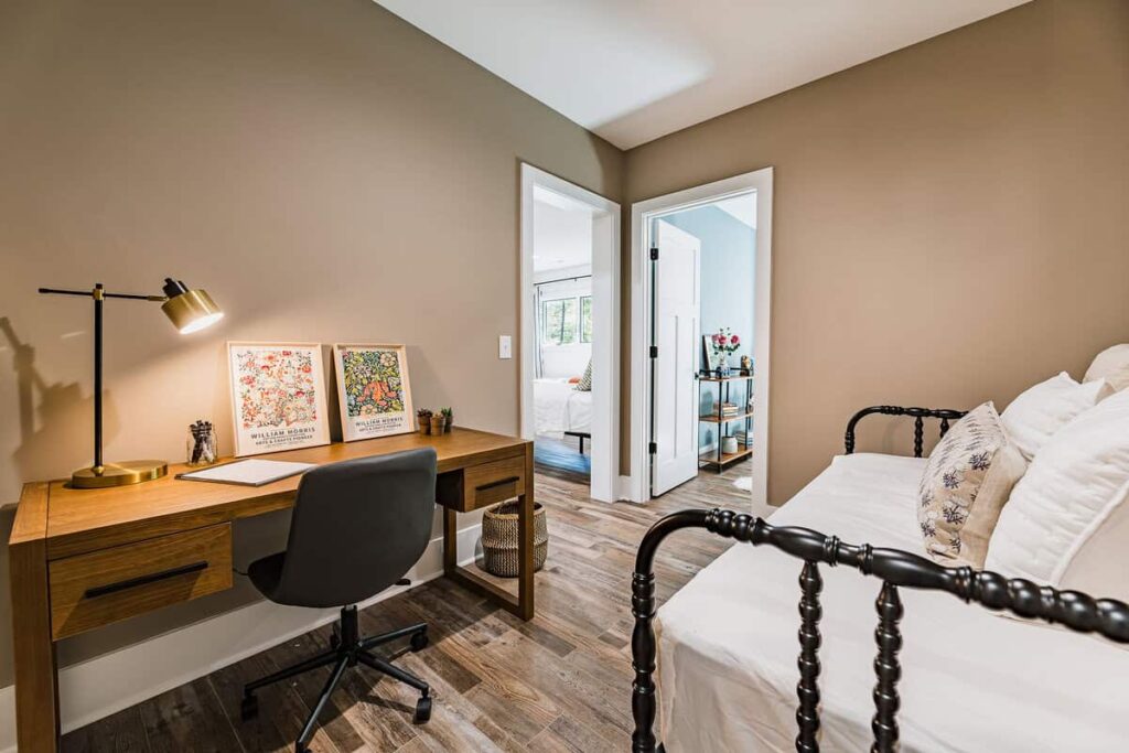 Office with a desk and day bed.